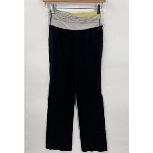 Lululemon Astro Yoga Pants Black/Green Criss Cross Waist Flare Leg Womens Size 4